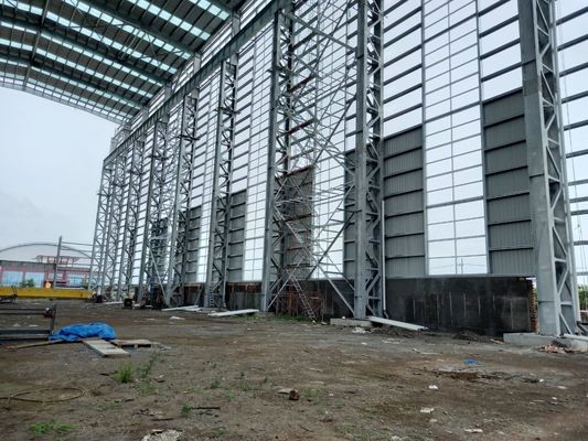 Q355 या Q235 फ्रेम वेयरहाउस प्रीफैब्रिकेटेड मेटल वर्कशॉप फैक्ट्री